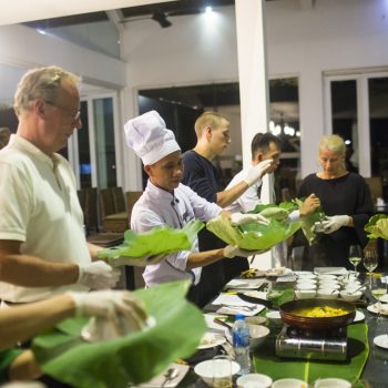 Tourist enjoying traditional Vietnamese cooking class in Hanoi